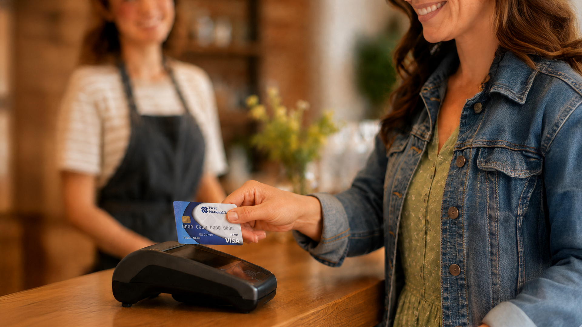A lady paying with her card